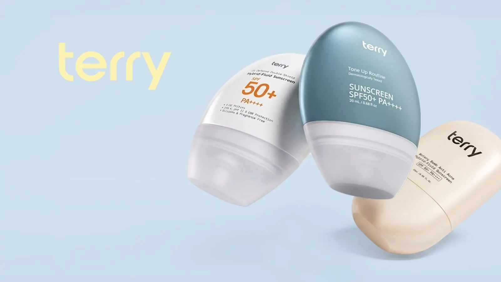 กันแดด TERRY สามรุ่นวางเรียงกันบนพื้นฟ้า — UV Defense หลอดขาว, Tone Up หลอดฟ้า และ Watery Bomb กันแดดขนมปังหลอดครีม